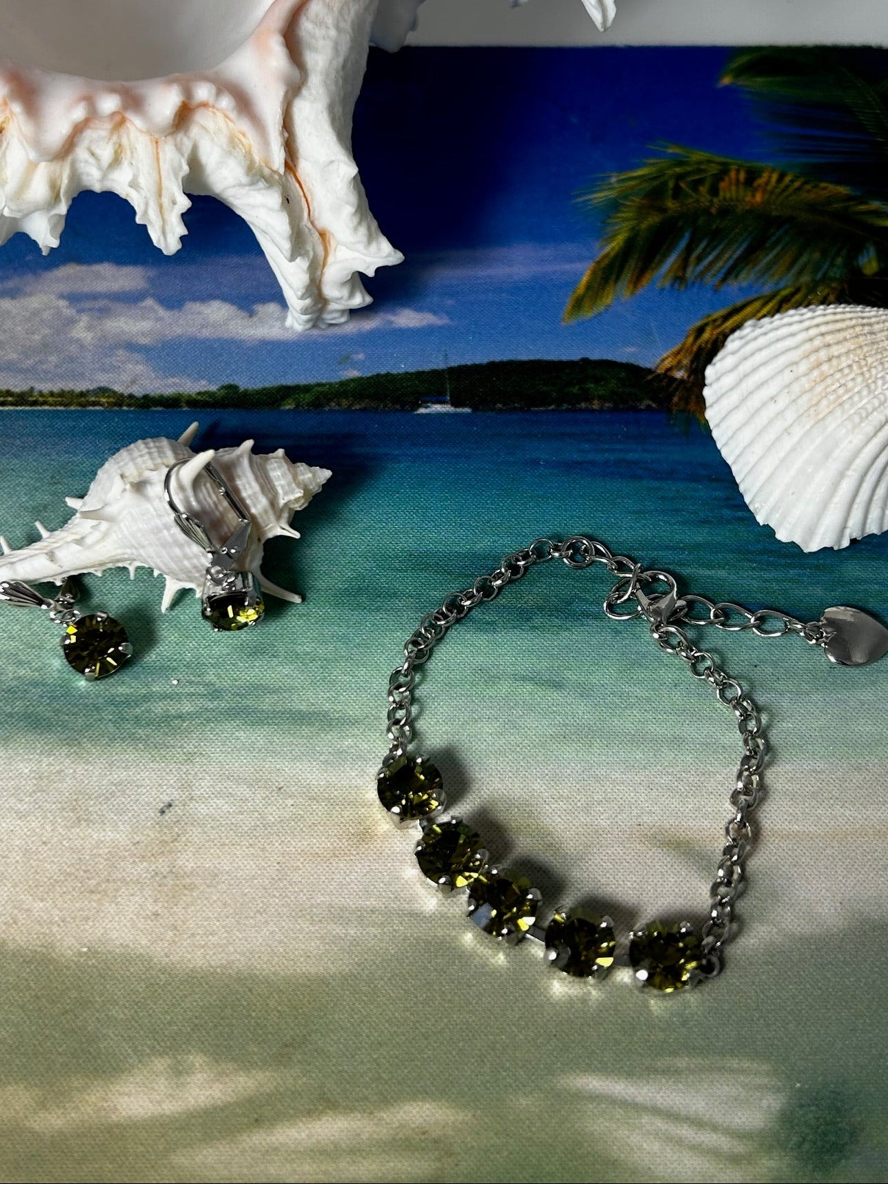 
Bracelet/earrings set! finished jewelry. Light olivine crystal with silver/rhodium adjustable bracelet with matching lever back earrings