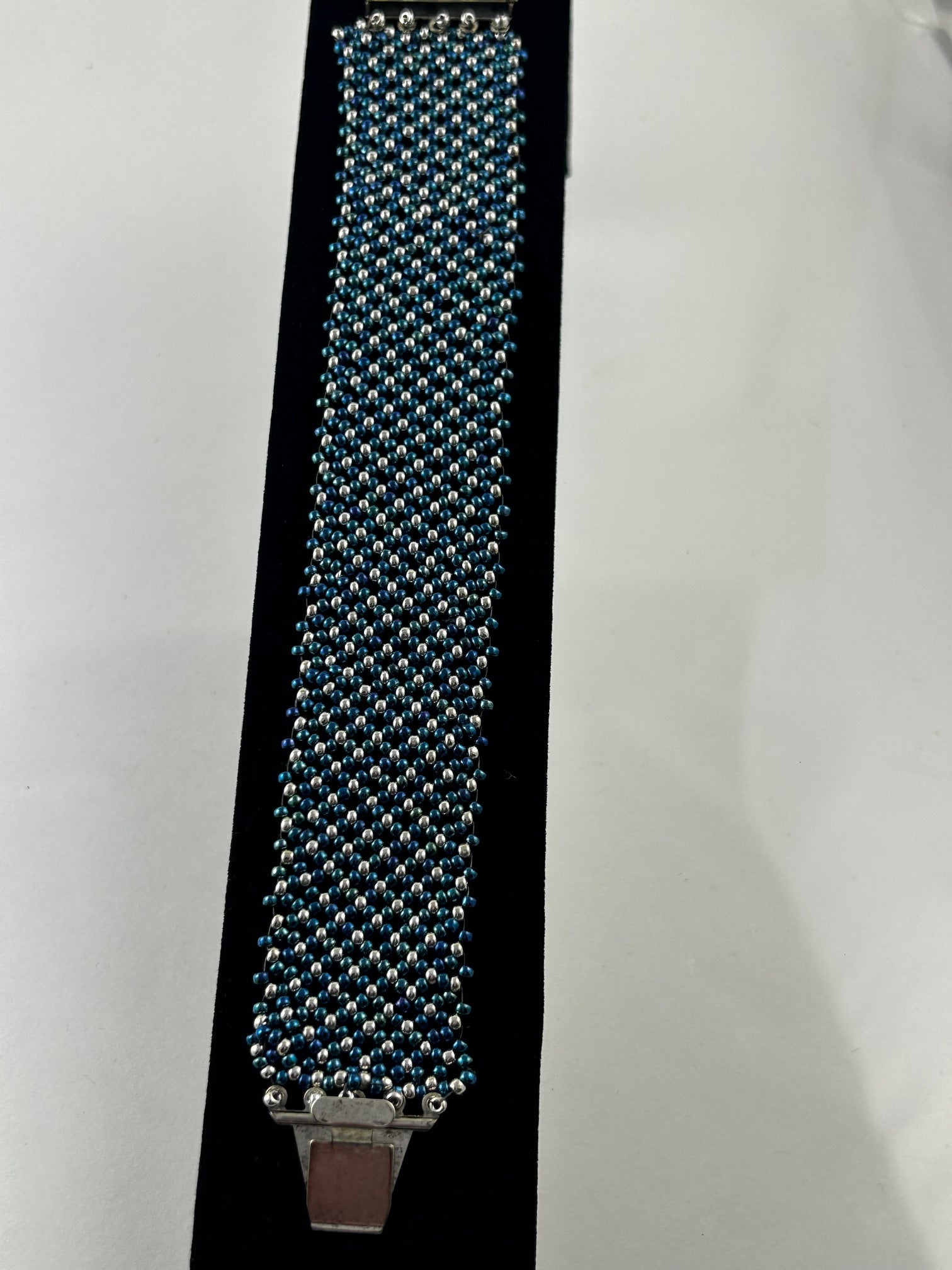 Bracelet, finished jewelry, Matte and rainbow, size 11 seed beads 3 drop netting bracket, with silver clasp